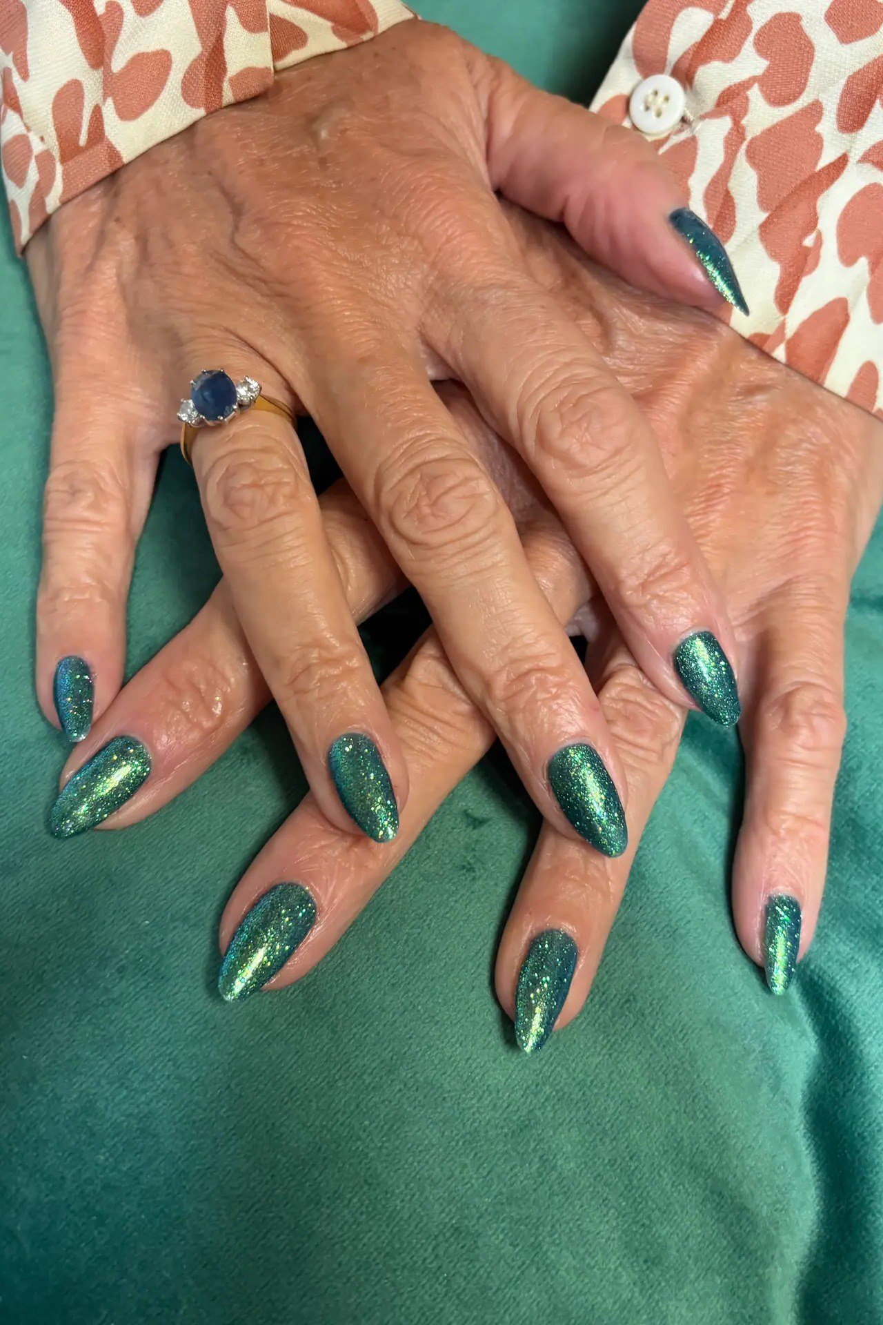 Glitter Emerald Almond Finale - emerald green nail design for women over 50