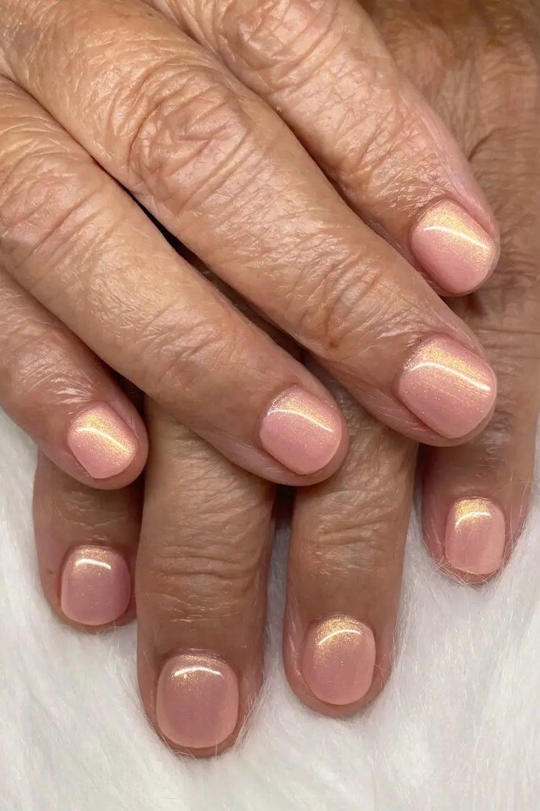 Peachy nude glossy nails, elegant nail idea for women over 50