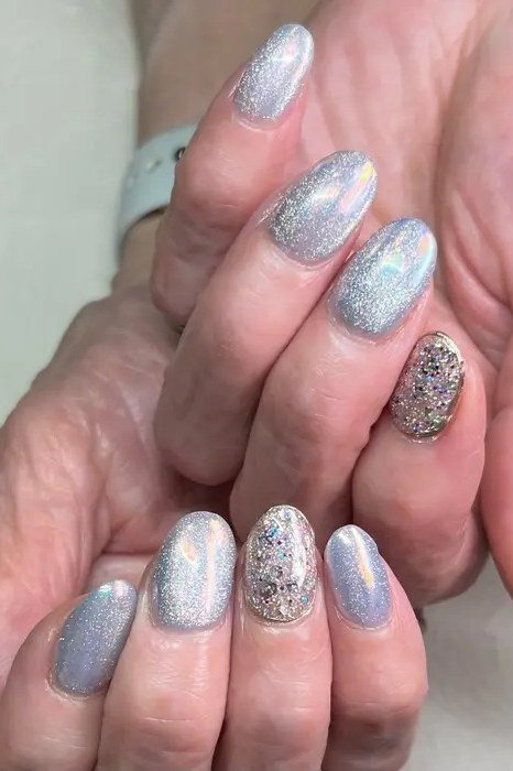 Silver holographic glitter nails, elegant nail idea for women over 50