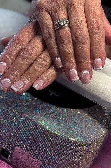 Sheer pink French manicure, elegant nail idea for women over 50
