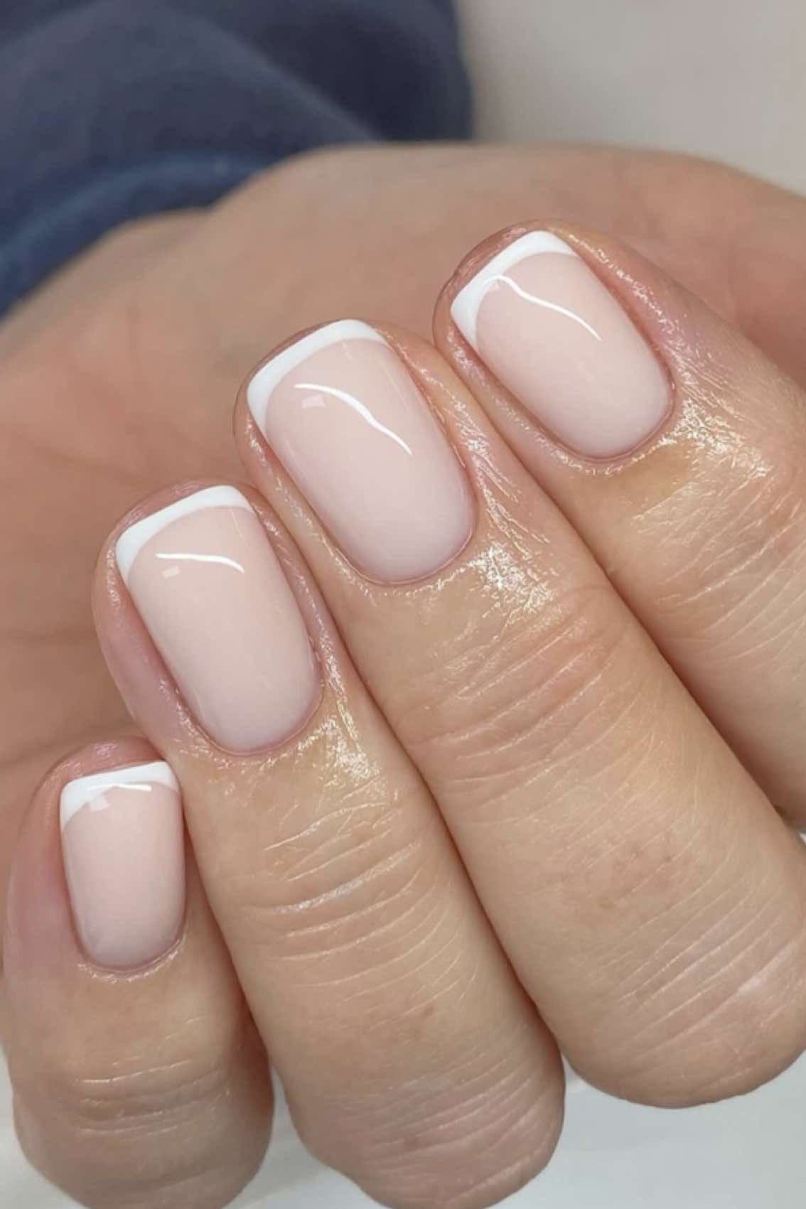 Classic white French tips close-up, elegant nail idea for women over 50