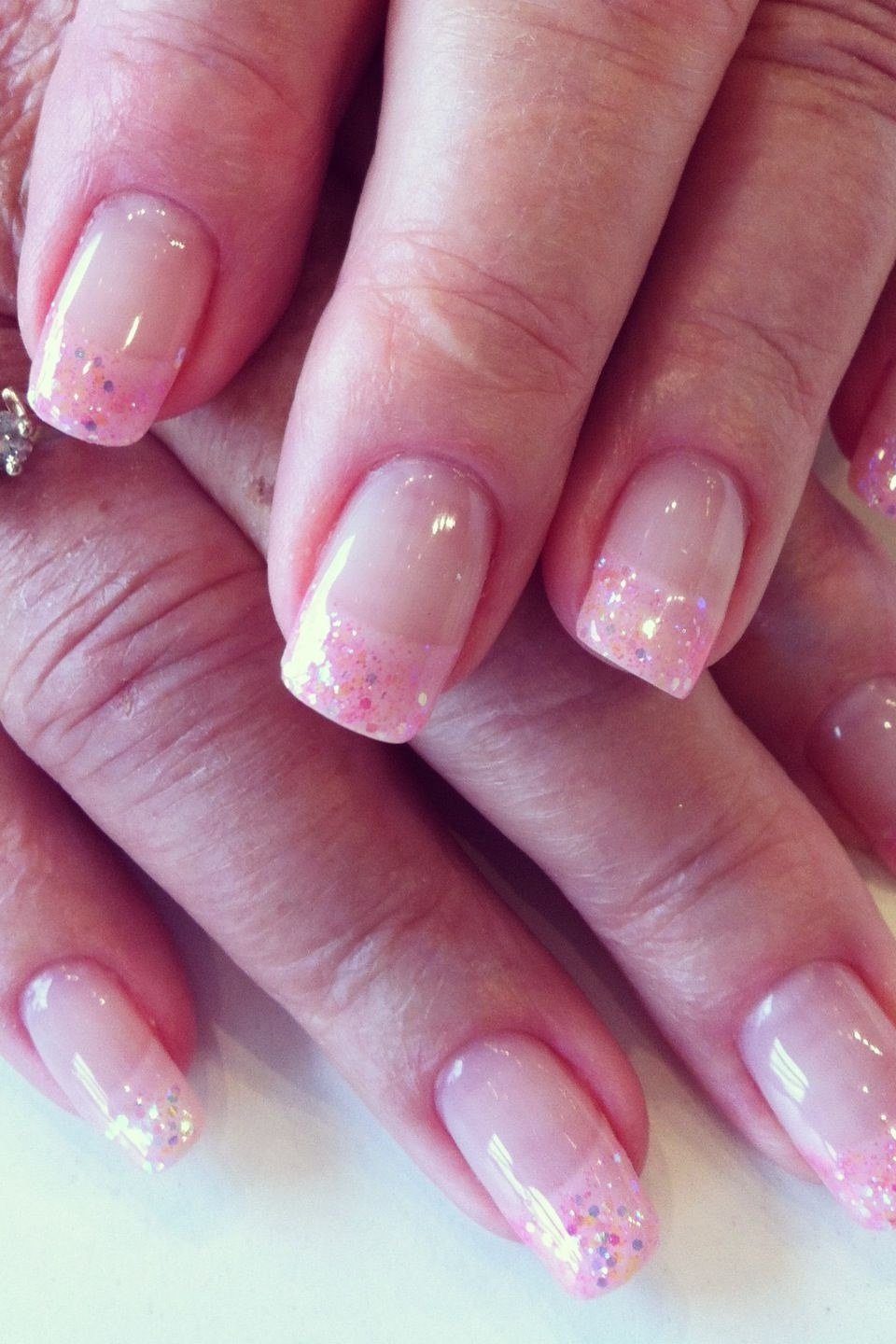 Pink glitter ombre nails, elegant nail idea for women over 50