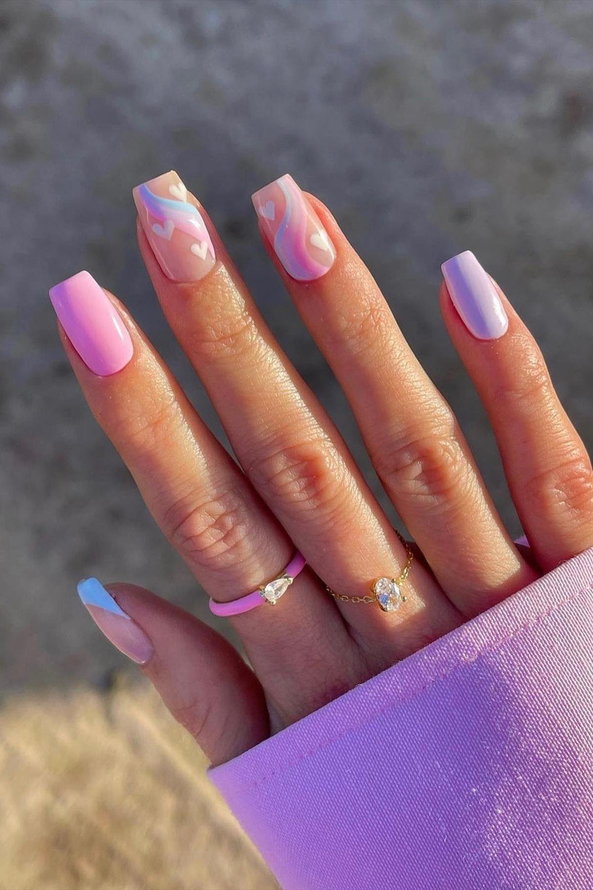 Pastel swirl nail art with hearts, elegant nail idea for women over 50