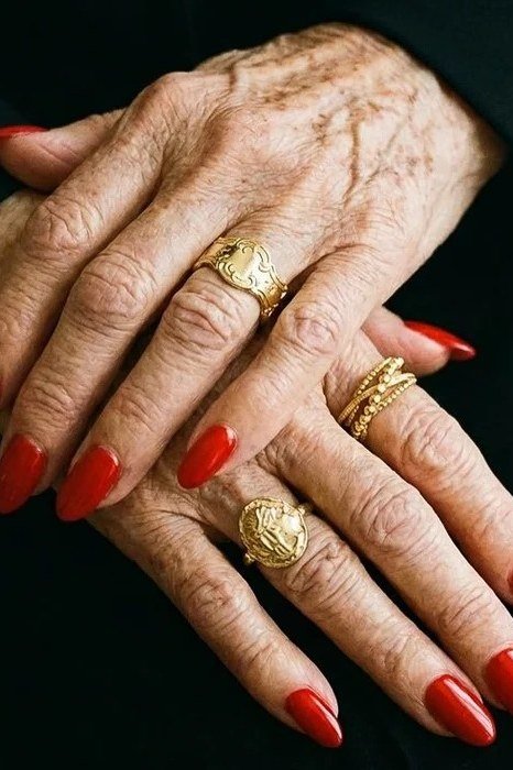 Glossy red nails on black background, elegant nail idea for women over 50