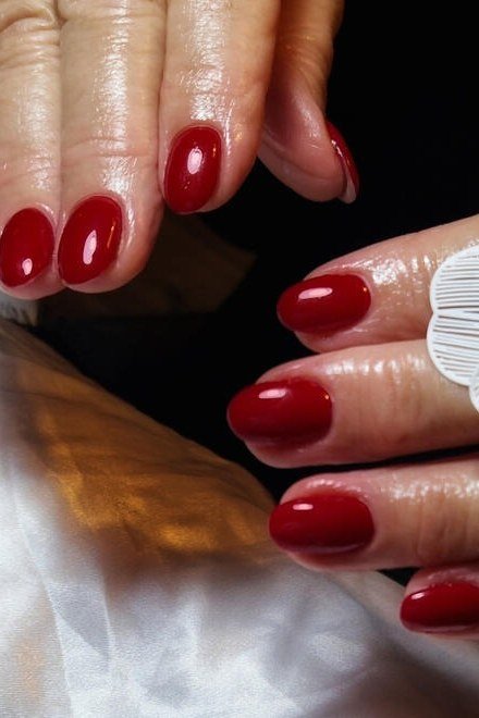 Deep Red with a Flower Ring, elegant nail idea for women over 60