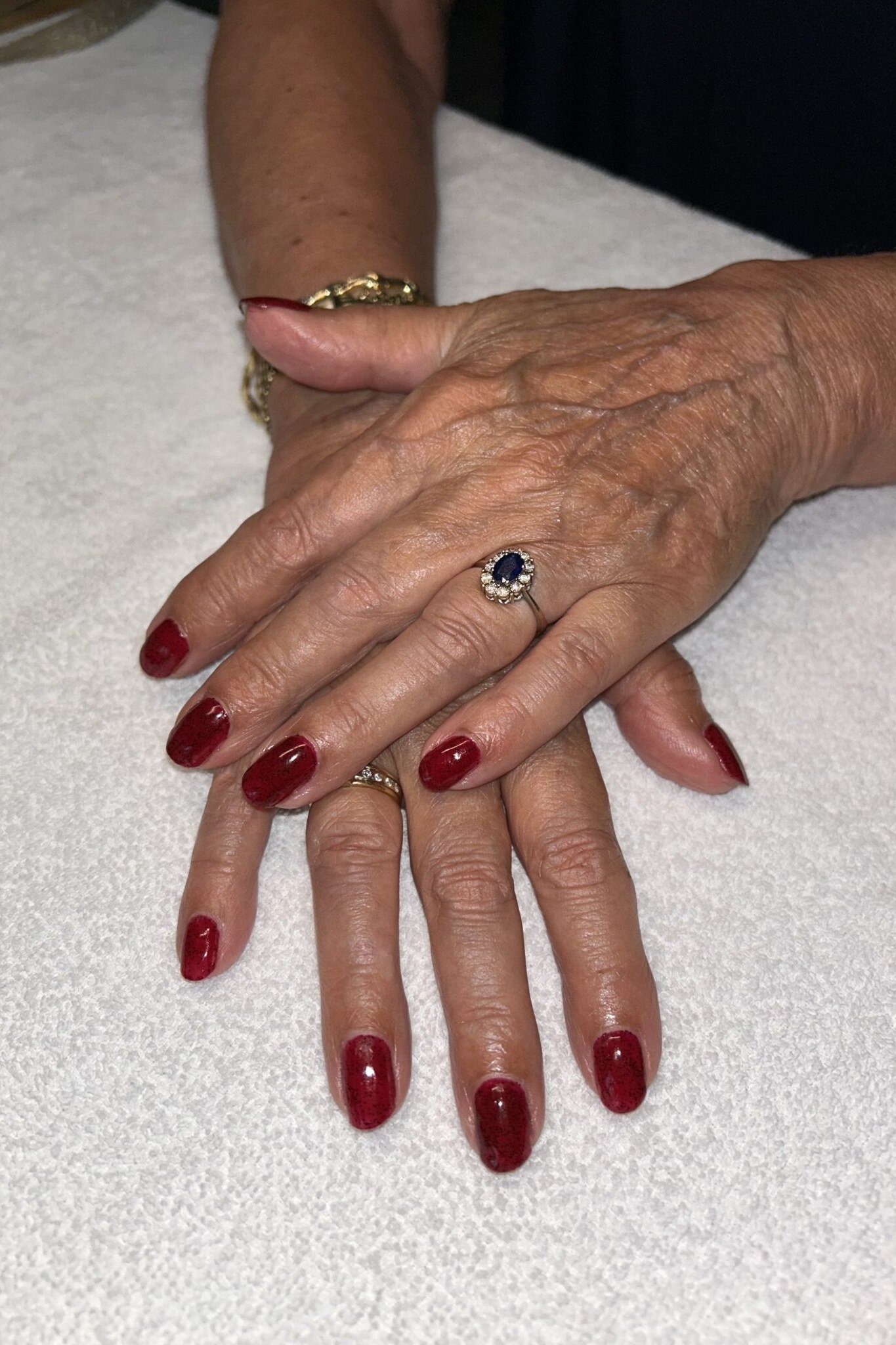 Rich Burgundy on a White Towel, elegant nail idea for women over 60