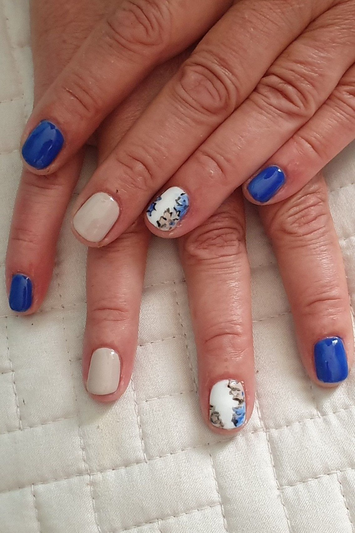 Bold Blue with a Glitter Accent, elegant nail idea for women over 60