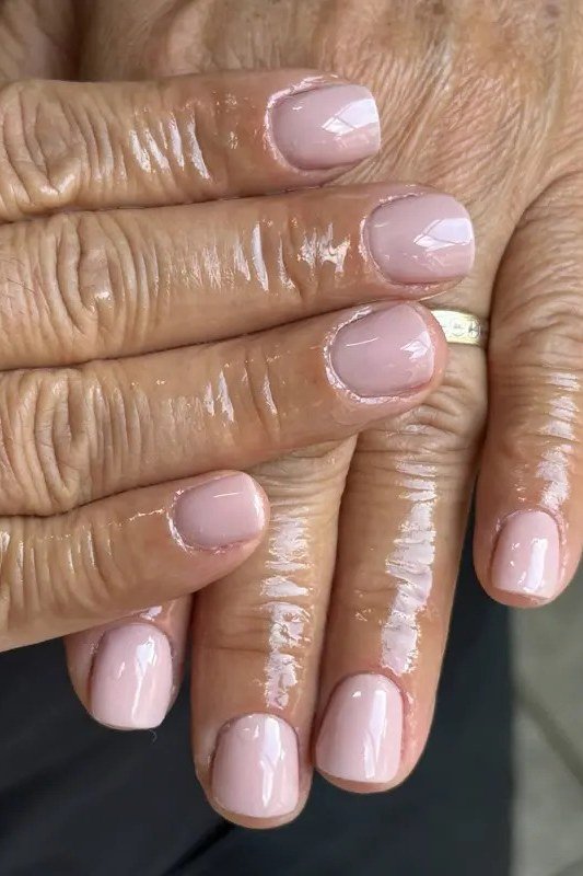 Blush Pink with Glitter Accents, elegant nail idea for women over 60