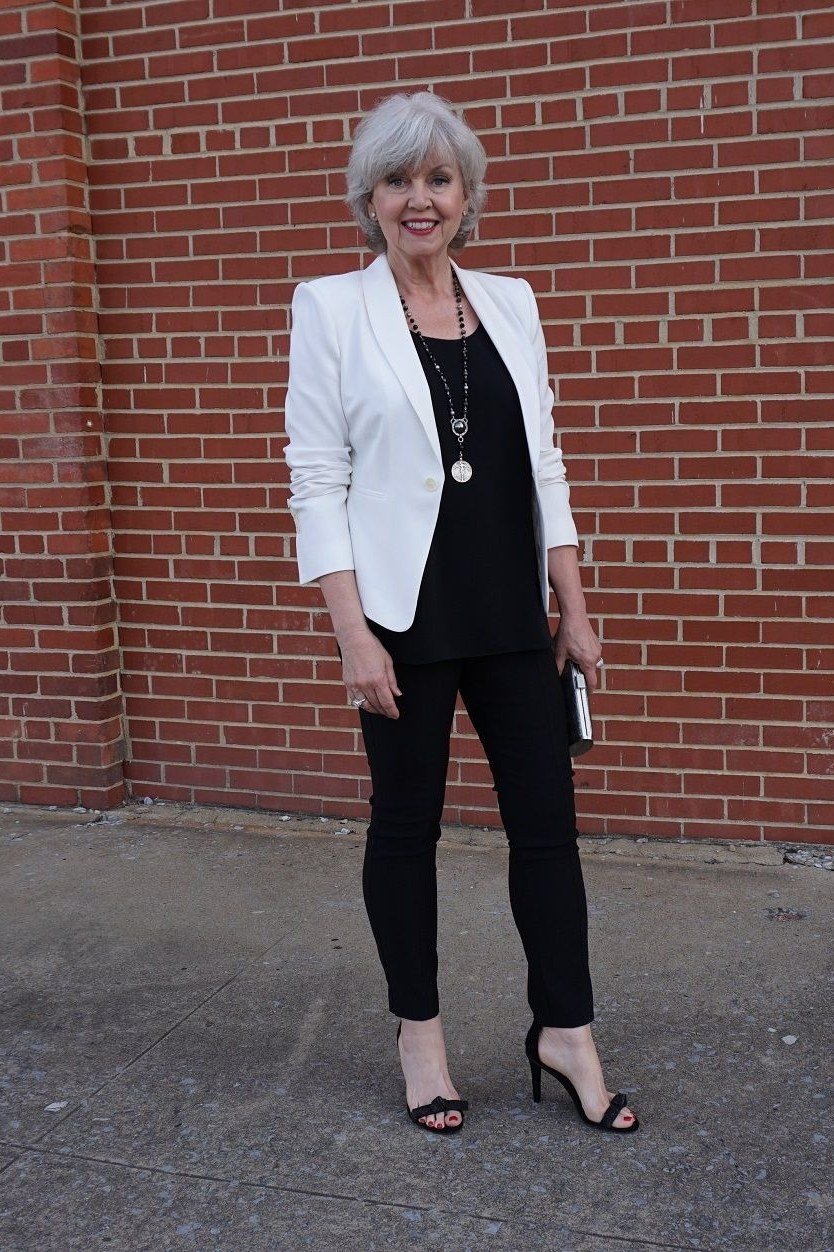 White blazer black top black trousers, elegant party outfit for women over 60