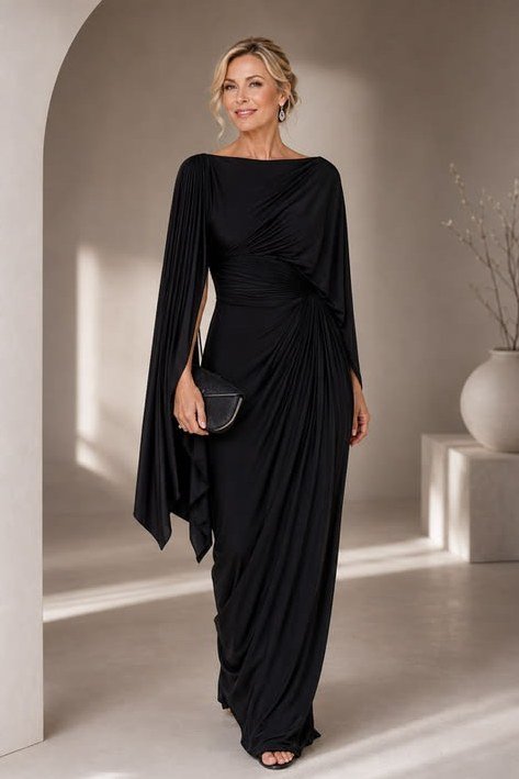 Black cape-sleeve draped gown, elegant party outfit for women over 60