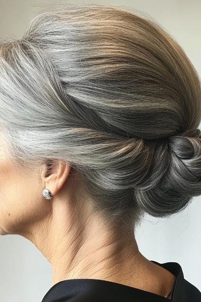 Silver smooth side bun in profile, an elegant updo for women over 70