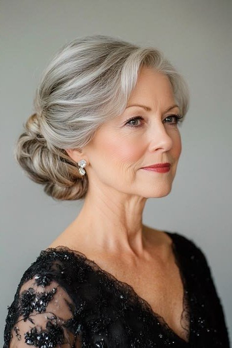Curly silver updo front view in lace dress, an elegant updo for women over 70