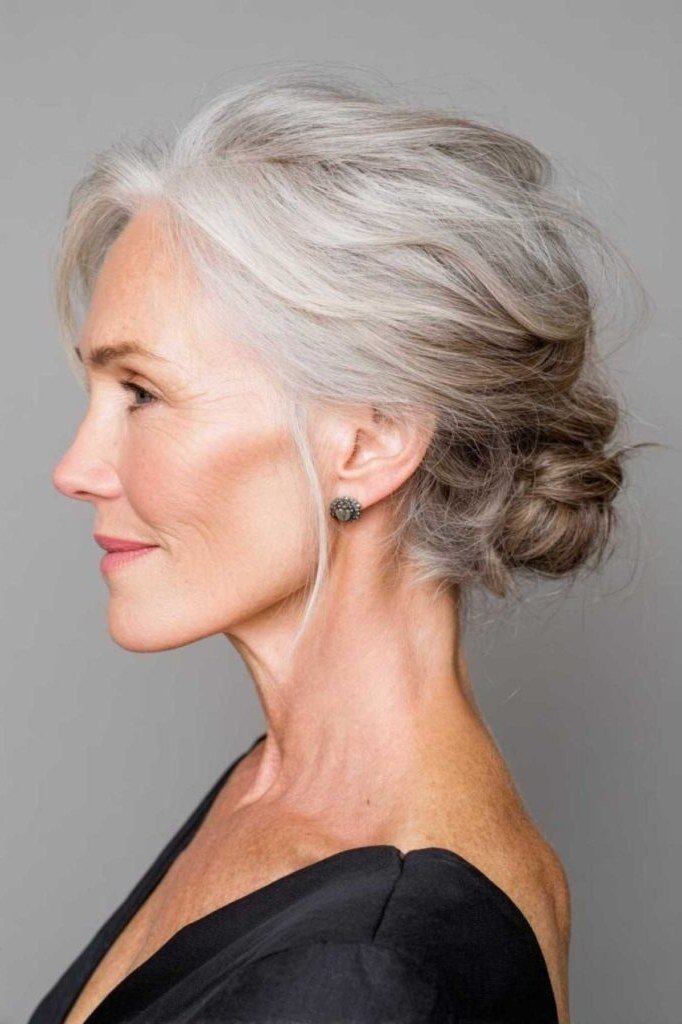 Small silver bun three-quarter view, an elegant updo for women over 70