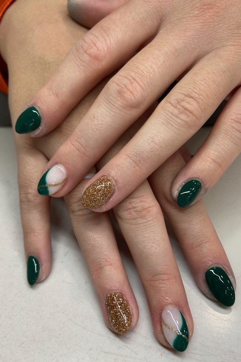Dark green nails with white and gold accents for women over 60
