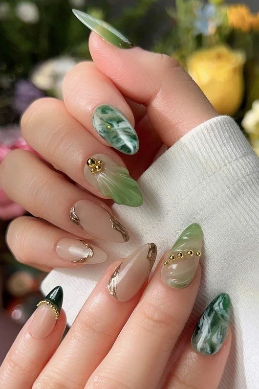 Nude and green marble nails with gold flecks for women over 60