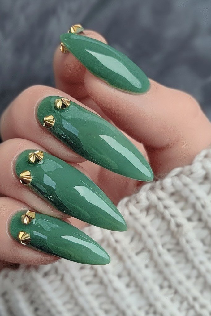 Sage green stiletto nails with gold studs for women over 60