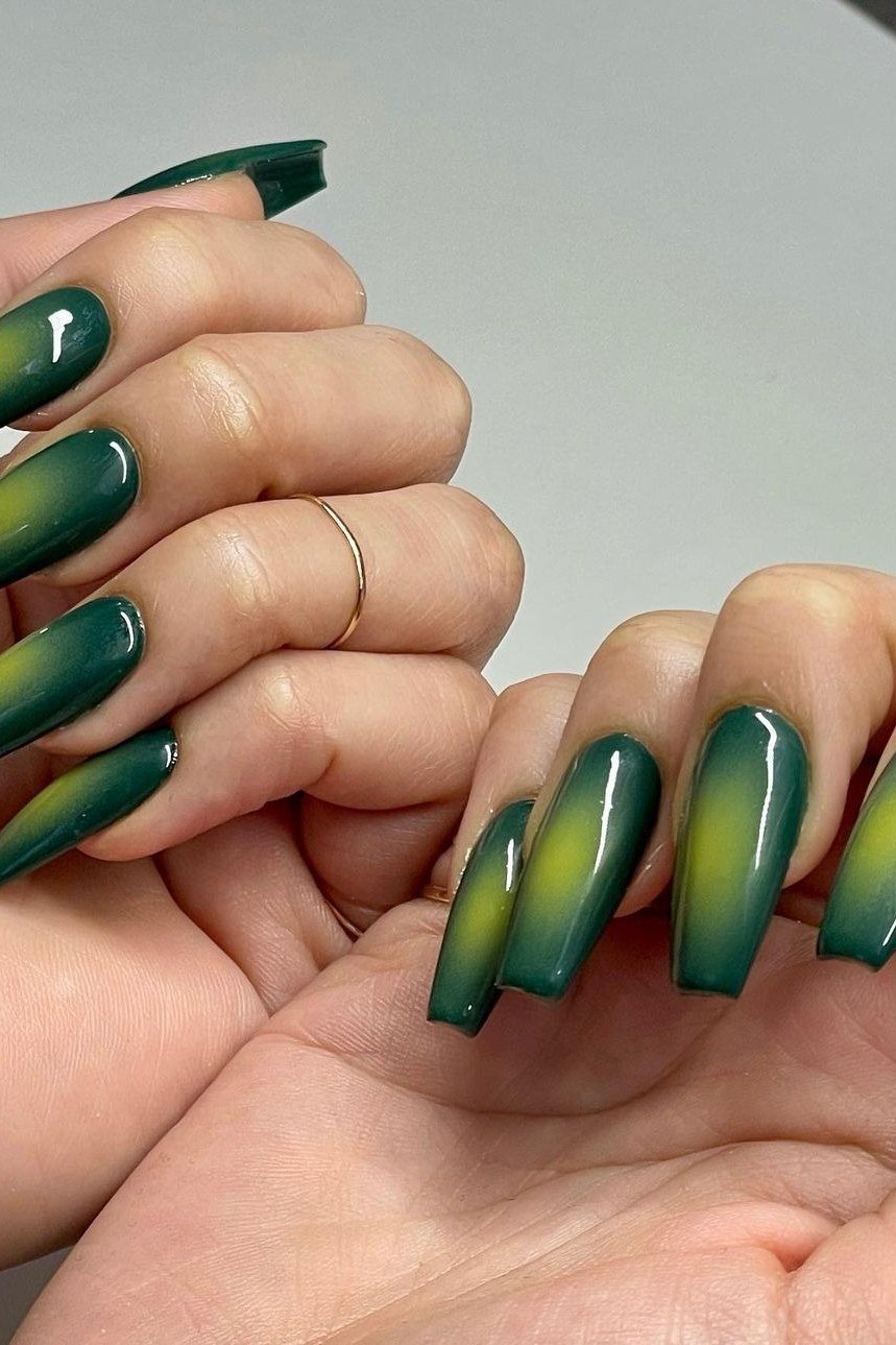 Green ombre coffin nails with gold shimmer for women over 60