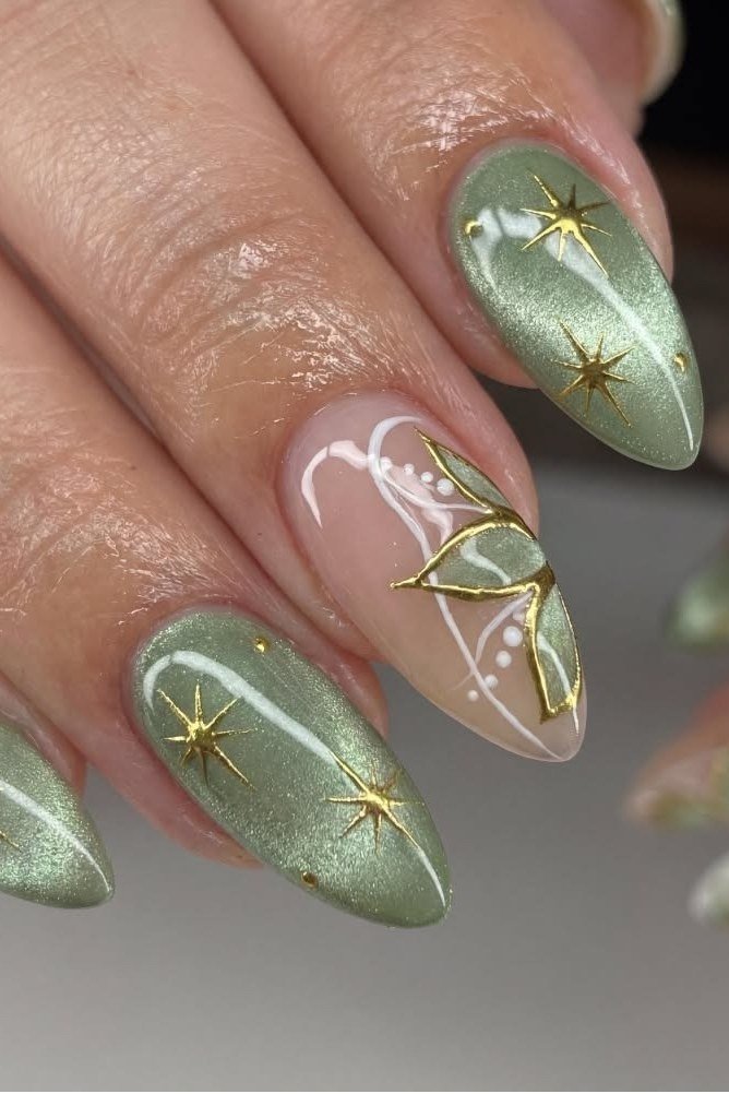 Sage green nails with gold starburst nail art for women over 60