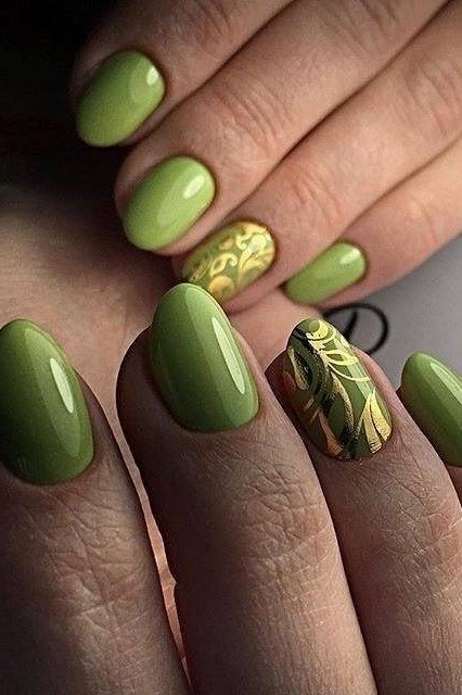 Green nails with gold floral nail art for women over 60