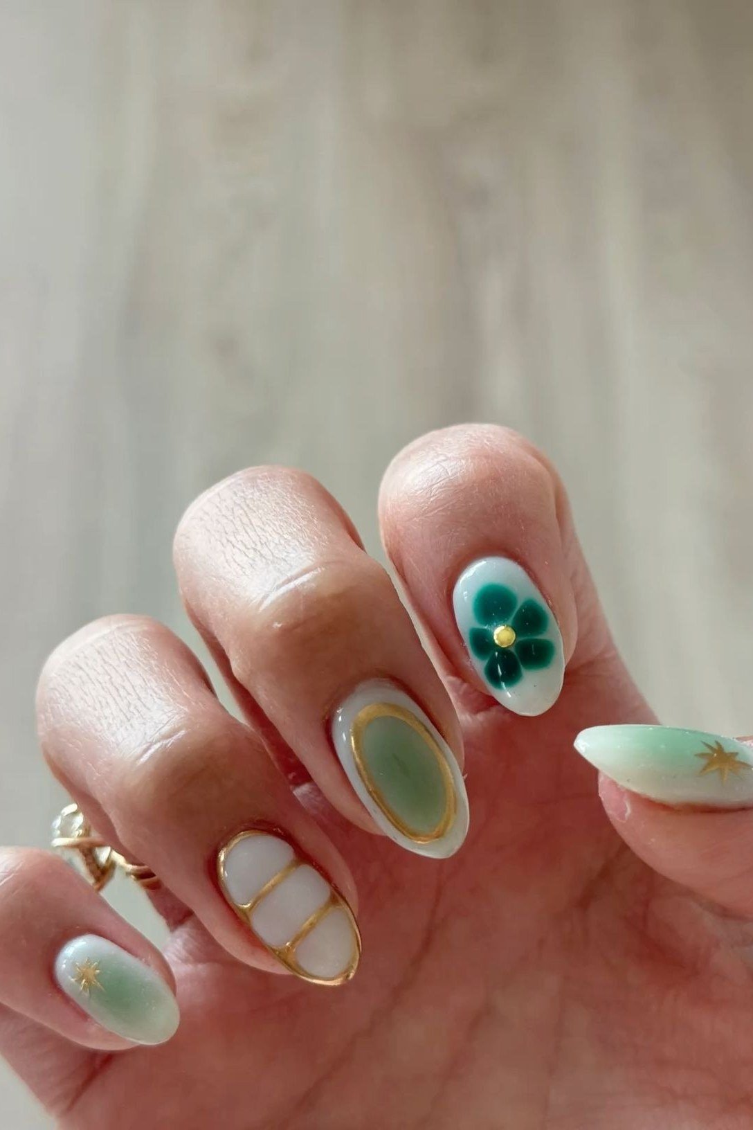 Mint green aura nails with gold details for women over 60