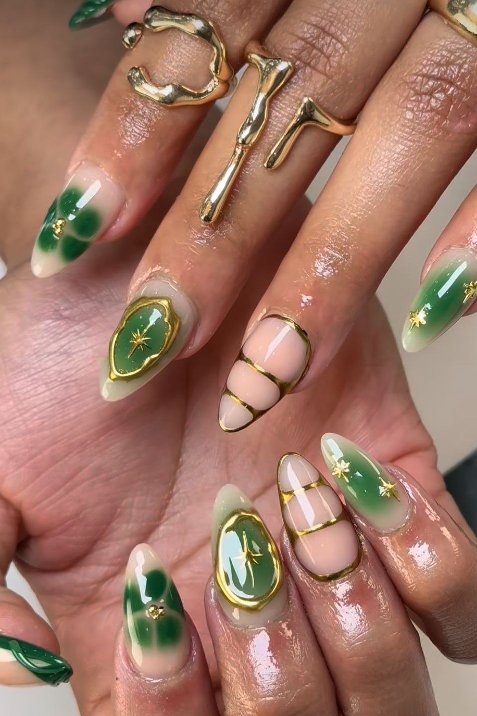 Green nails with gold gem accents for women over 60
