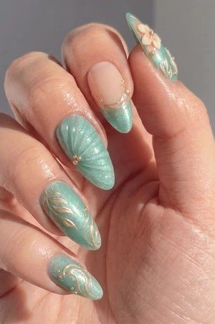 Mint green nails with gold shell nail art for women over 60
