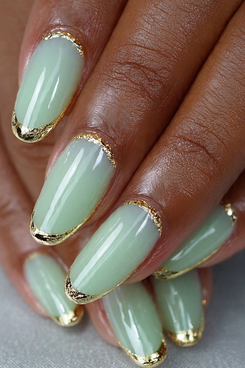 Mint green French nails with gold edges for women over 60