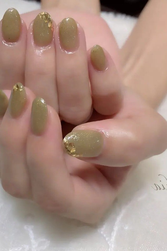 Khaki green nails with gold accents for women over 60