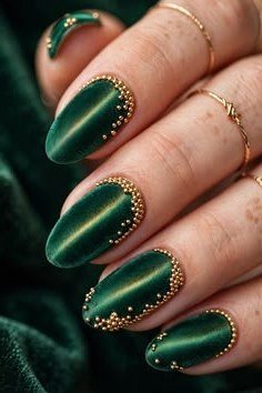 Dark green nails with gold beaded edges for women over 60