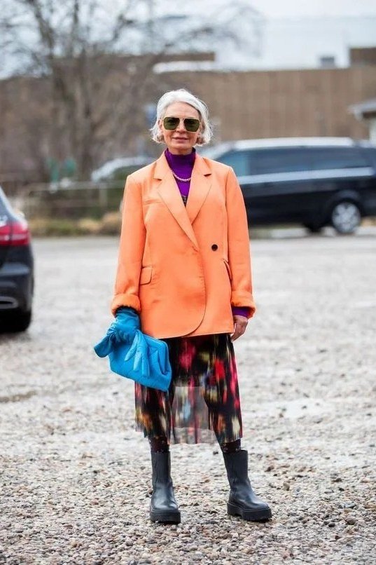 Orange Coat with Purple Top and Floral Skirt, elegant winter outfit for women over 60
