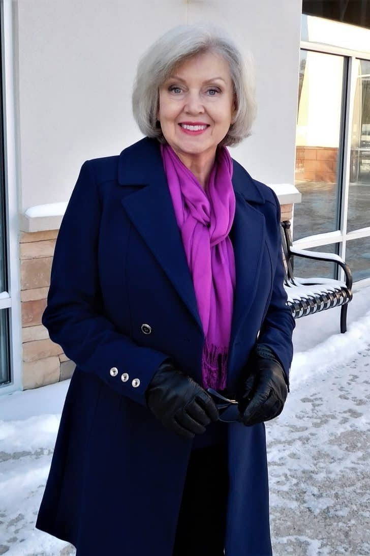Navy Coat with Magenta Scarf in the Snow, elegant winter outfit for women over 60
