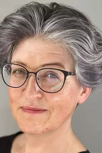 Salt and Pepper Wavy Pixie with Glasses, an elegant short haircut for older women