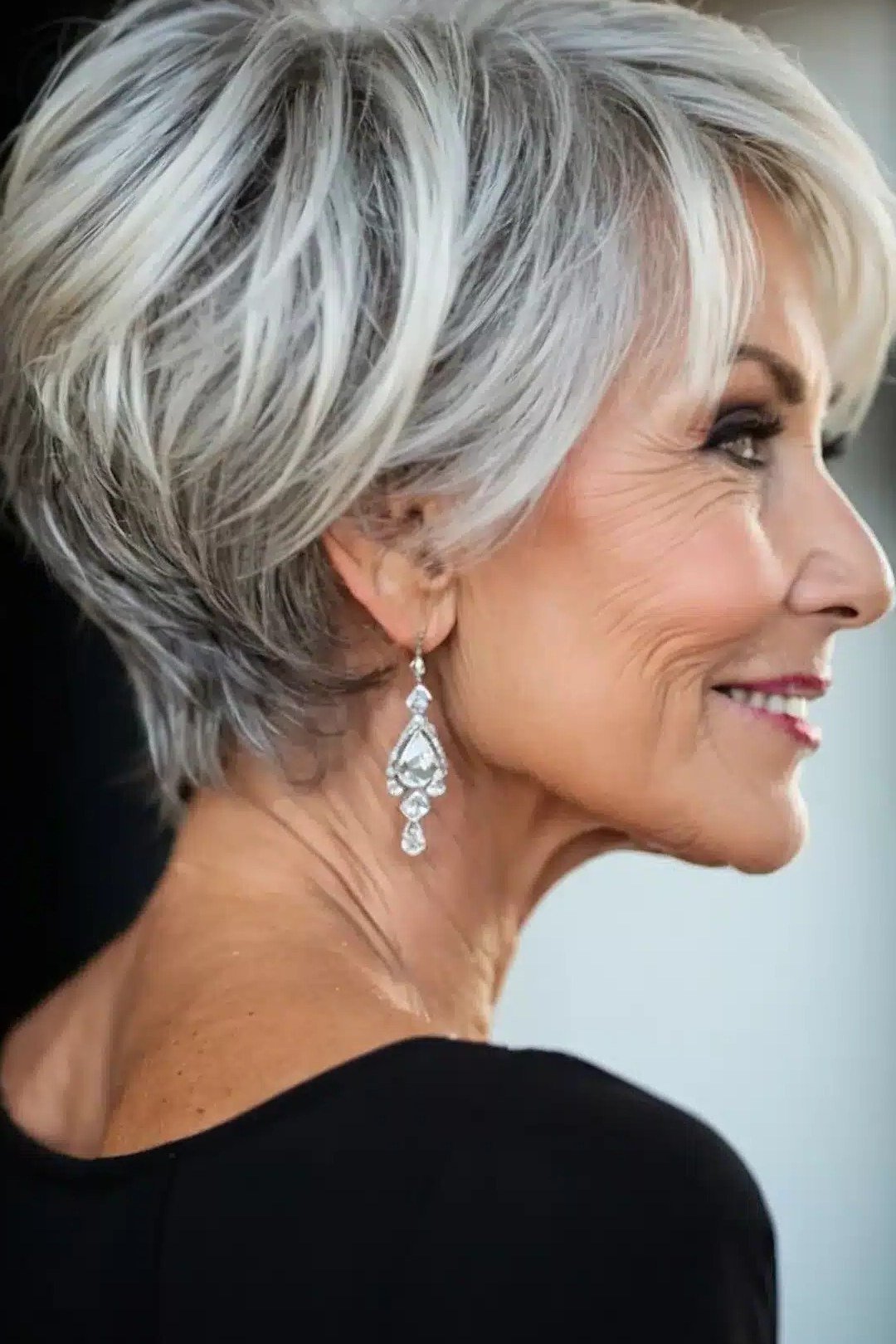 Cropped Silver Pixie with Earrings, an elegant short haircut for older women