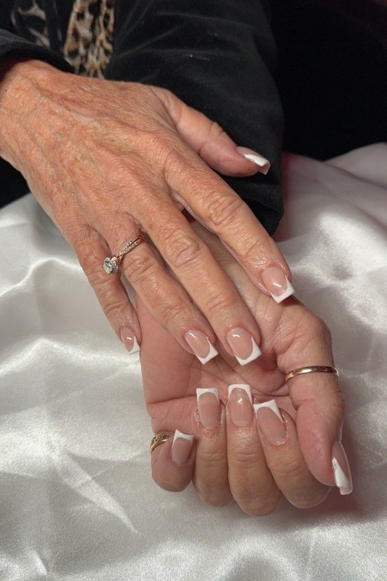 Classic French Tips with Delicate Rings, elegant winter nail color idea for older women