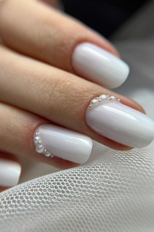White Nails with Pearl Cuticle Accents - elegant wedding nails for women over 60