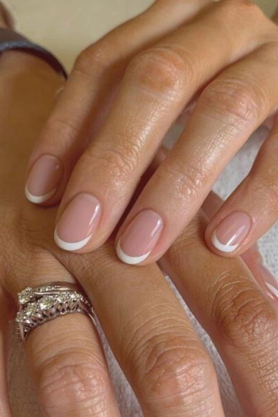 Thin White French Lines - thin white french lines on pink almond nails - elegant nail idea for women over 40