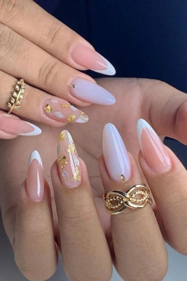 White and Pink French With Gold Flecks - white and pink french tips with gold flecks and rings - elegant nail idea for women over 40