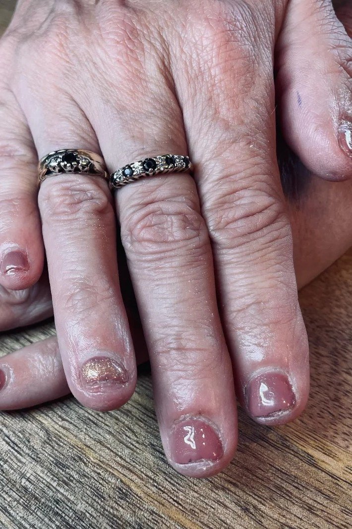 Mauve Nails With Gold Glitter - mauve nails with gold glitter accents, aged hands with dark rings - elegant nail idea for women over 40