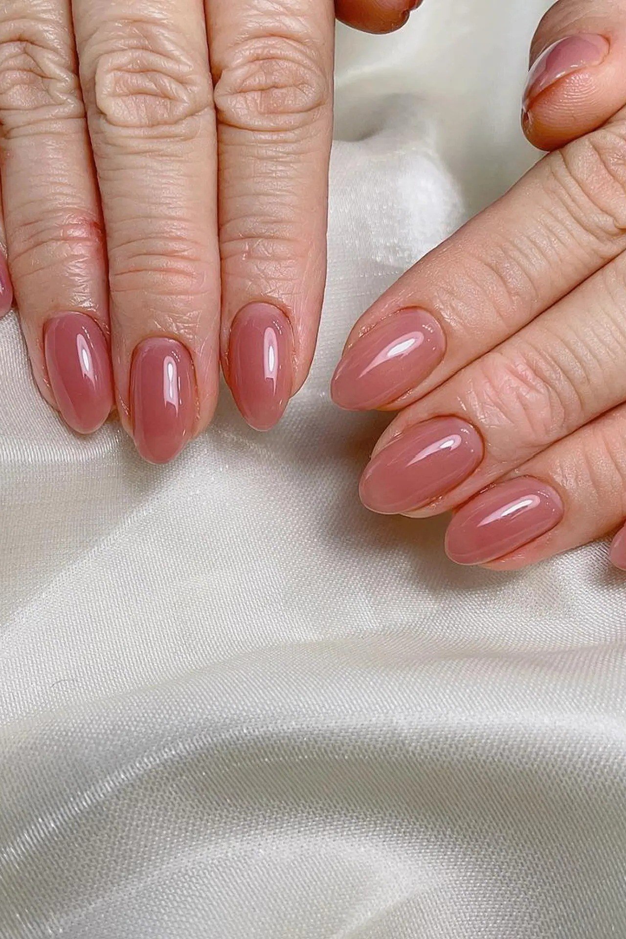 Rose-Pink Almond Nails on Satin - rose-pink almond nails on white satin - elegant nail idea for women over 40