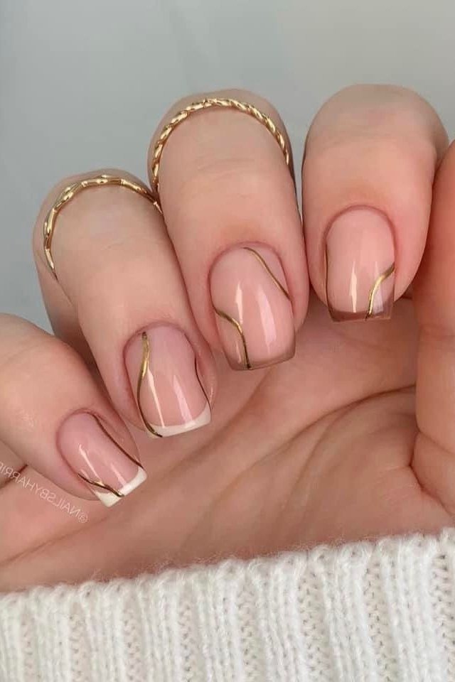 Nude Nails With Gold Wavy Line Art - nude nails with gold wavy line art and rings - elegant nail idea for women over 40