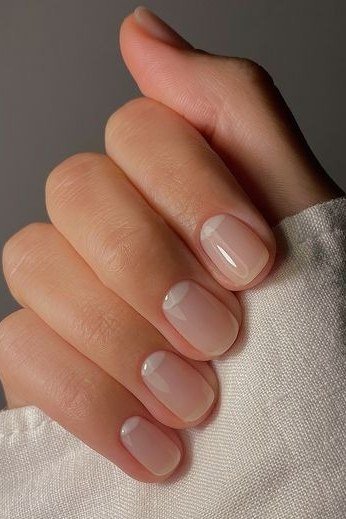 Glossy Nude Short Oval Nails - elegant short nail idea for women over 50