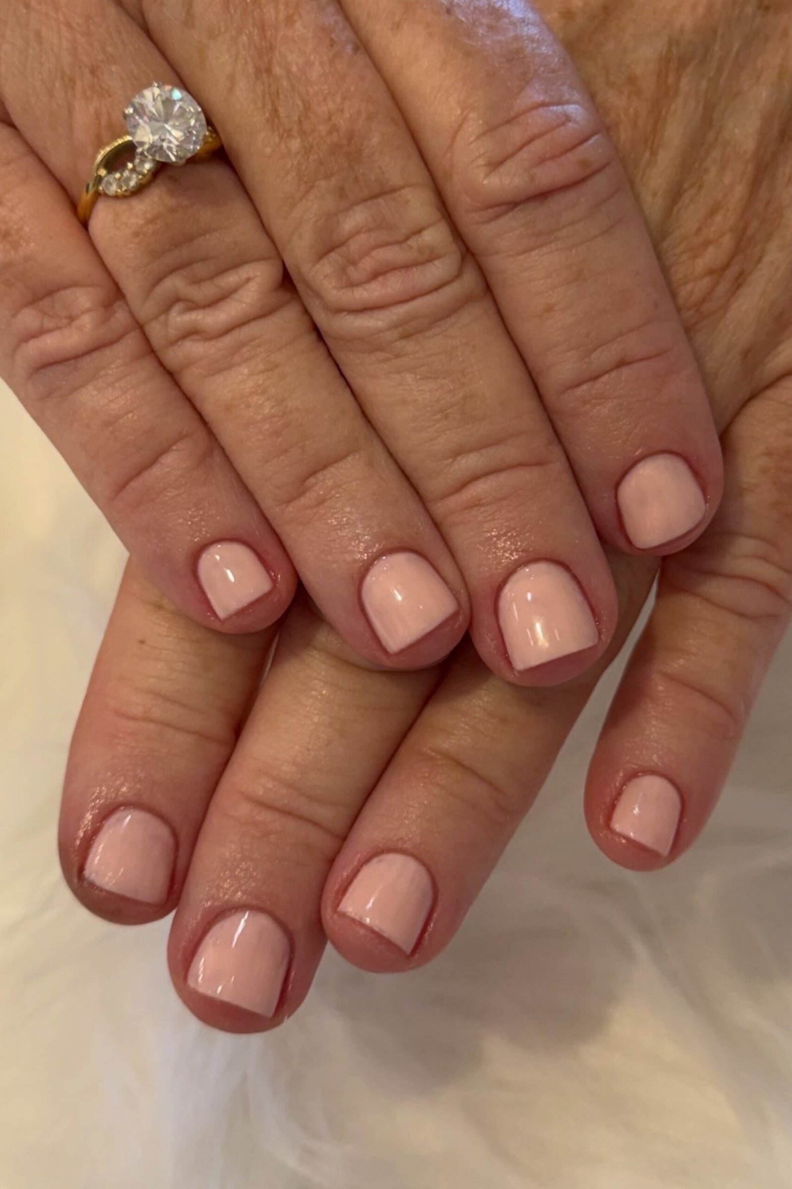 Classic Nude Pink Short Nails - elegant short nail idea for women over 50