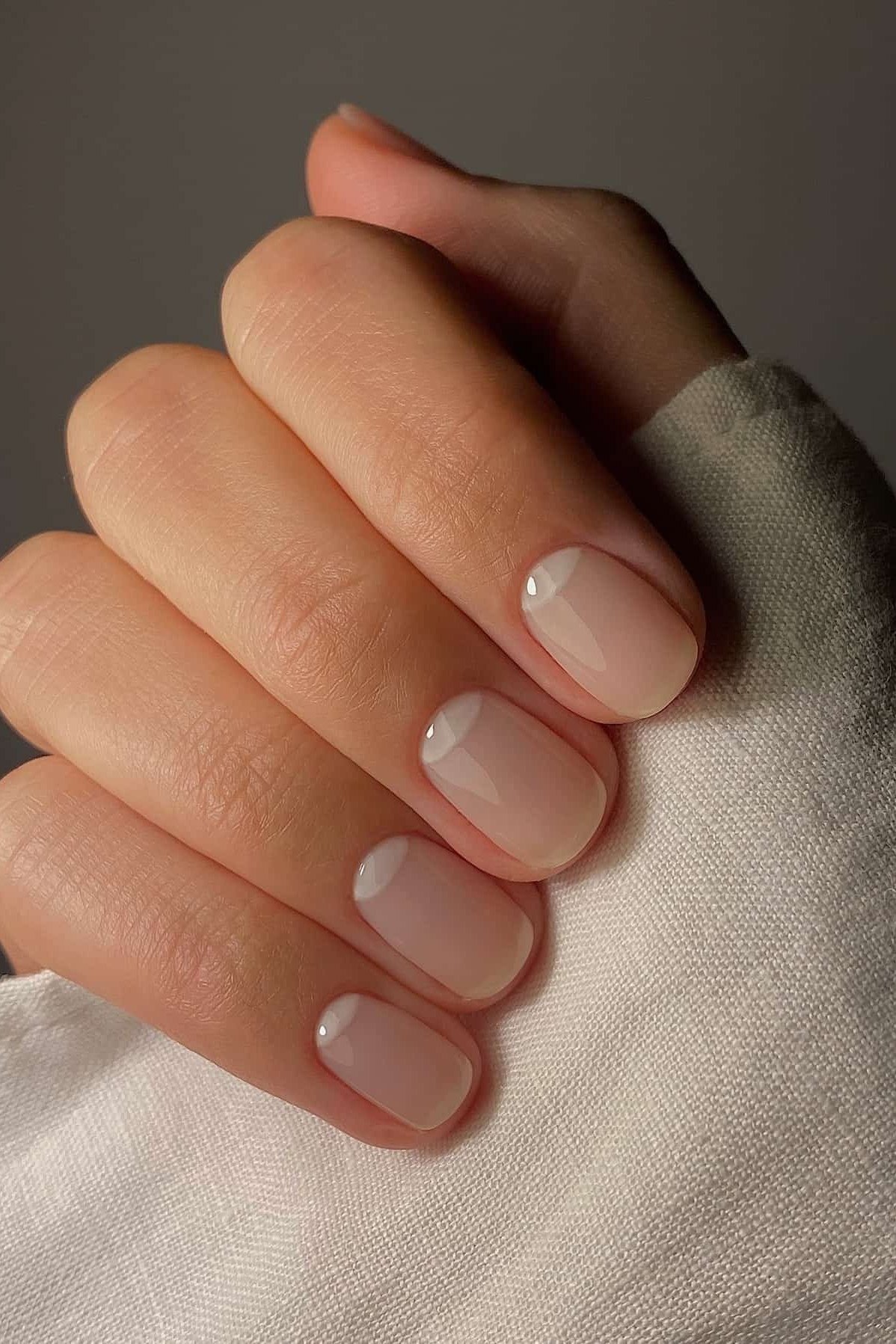 Milky White Nails with Cream Knit - elegant short nail idea for women over 50