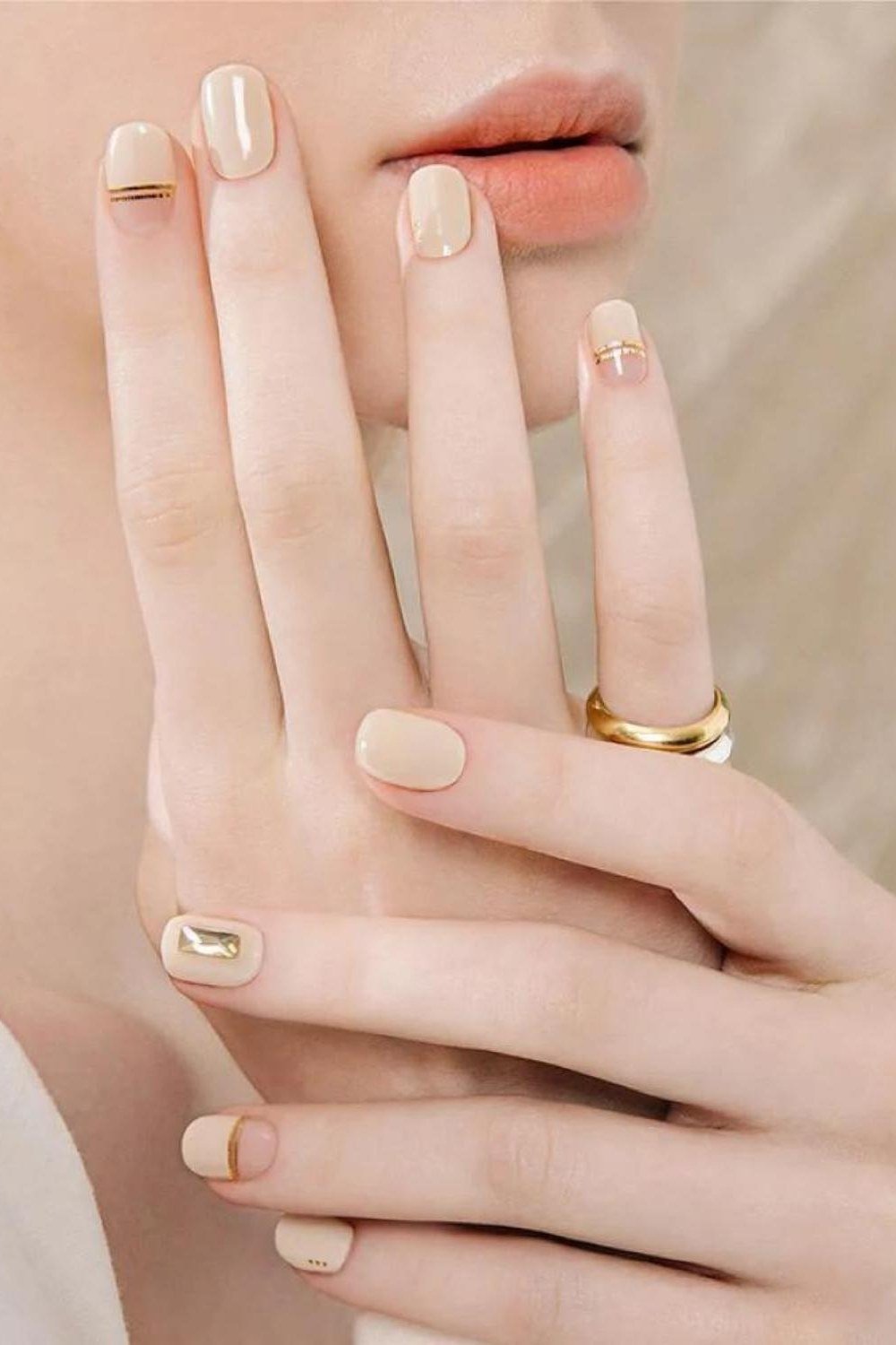 Nude Nails with Tiny Gold Studs - elegant short nail idea for women over 50