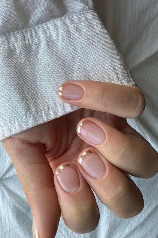 Nude Nails with Gold Half Moons - elegant short nail idea for women over 50