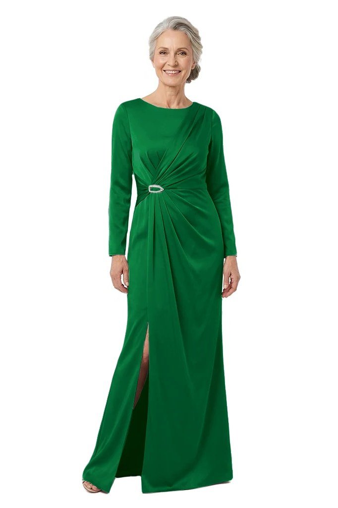 Emerald green formal gown with side slit and twist waist on a woman over 60