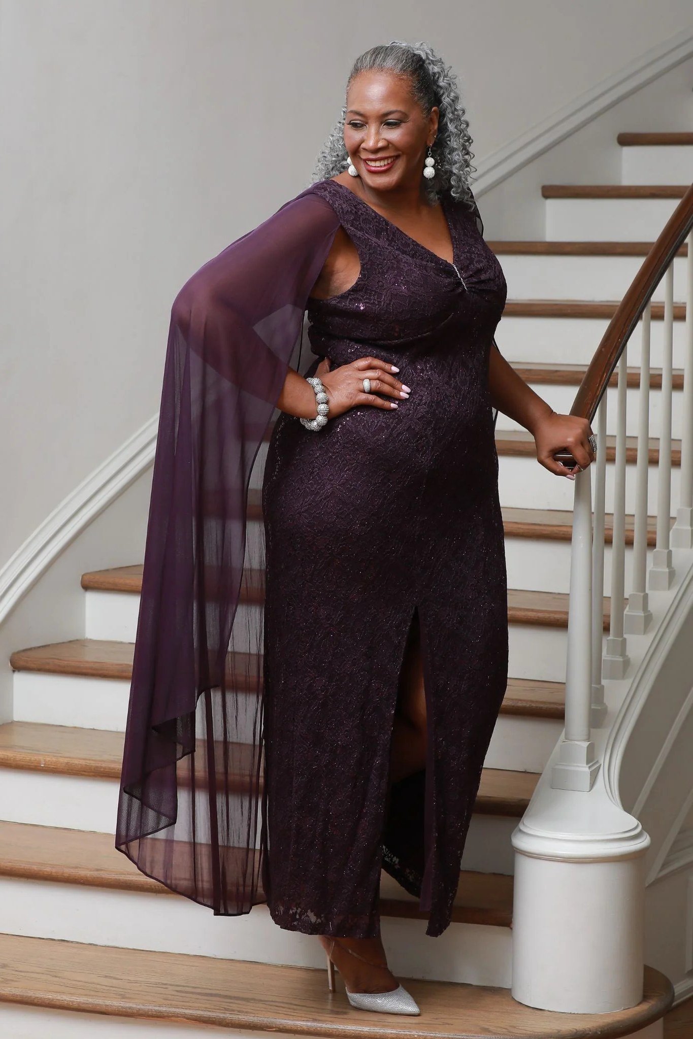 Plum evening gown with sheer overlay and slit for women over 60