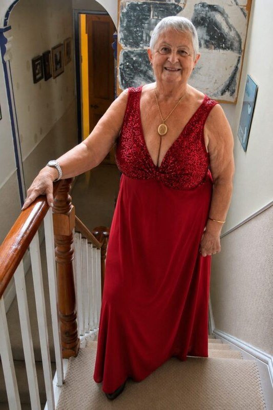 Red satin V-neck evening gown for women over 60