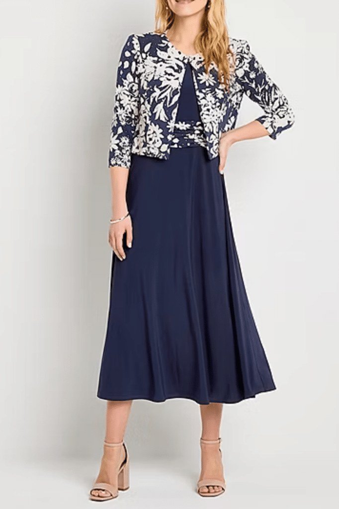 navy pleated midi skirt with floral cropped jacket and nude heels, product shot - fall outfit idea for women over 70
