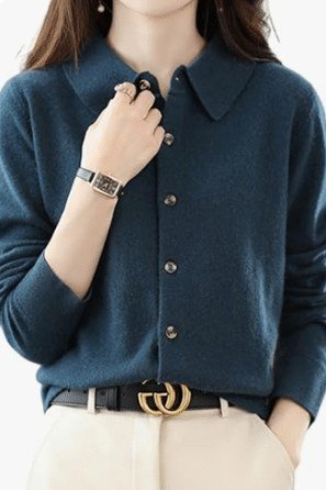 teal knit polo shirt with collar and gold belt, white trousers, close-up product shot - fall outfit idea for women over 70
